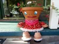 This is a flower pot girl I made for my front porch. Do you like her?