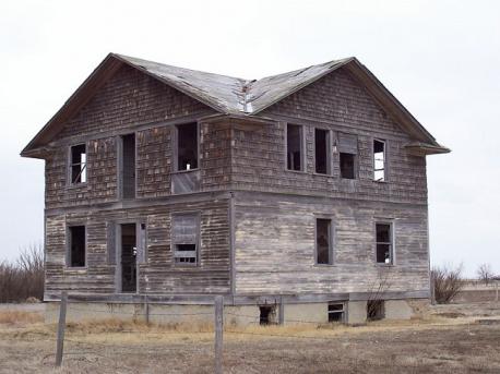 The definition of a ghost town varies between individuals, and between cultures (image: Robsart Hospital, one of many abandoned buildings in Robsart, Saskatchewan). Which statement do you agree with?