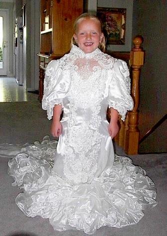 Pictured: (James in a wedding dress as a child). 