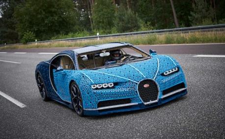 Source: Slash Gear. This may be the coolest LEGO project ever made. LEGO has taken real LEGO Technic parts and used those parts to construct a life-size and drivable replica of the Bugatti Chiron. This is the first large-scale movable construction that was developed using over a million Technic elements and powered using LEGO Power Function platform. The replica has 2,304 motors and 4,032 LEGO Technic gear wheels. Are you familiar with this story?