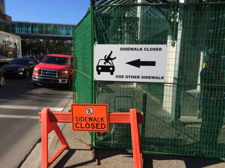 Construction crews placed the above sign as a warning to pedestrians. What do you think of this sign?