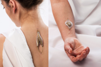 Naomi Kizhner, an industrial designer and graduate student from Hadassah College in Jerusalem, has designed jewelry that theoretically extracts energy from the wearer's own body. The 'speculative' jewelry is embedded into the person's veins and uses their blood to turn small wheels inside the device. The jewelry is not meant to be a practical energy source, but a discussion piece 