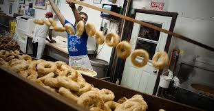 Authentic Montreal bagels are boiled in water with honey, and as a result are sweeter than New York bagels. But the bigger difference is that they are cooked in wood-fired ovens, which gives them a crunchier crust and a deeper, richer crust flavor. Montreal bagels have a much bigger hole, mainly as a result of the dough tube that forms the bagel being notably thinner than New York style. For this reason, while Montreal bagels are excellent on their own or with spreads, they don't make for as user-friendly a sandwich. This is especially true with messier breakfast sandwiches. In general, Montreal shops do fewer flavors than are found in New York, but often some odder ones. The standards are similar: plain, sesame, poppy, cinnamon raisin, whole wheat and everything — except they call this version