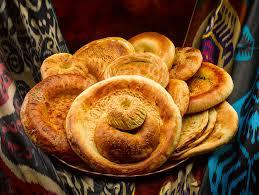 In Uzbekistan their citizens have several superstitions surrounding bread, which is considered sacred in this former Soviet republic. These include not placing bread upside down, as that's considered rude, and breaking off a chunk of bread when leaving home, so it's preserved when you come back. Maybe they have reason to be this superstitious about their bread -- Uzbek bread, called generally non or lepeshka, is round and flat and is baked in tandyr (clay oven), after which it comes out toasted and crispy. Have you ever tasted this type of bread?