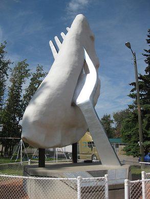 If your idea of a big meal is, well, a BIG meal, then you just might want to add these giant food attractions to your travel bucket list. Alberta, Canada is home to the biggest perogy in the world. Perched on a large fork, the World's Largest Perogy in Glendon, Alberta stands 27 feet tall and weighs approximately 6,000 pounds. That's a HEAVY perogy! Sour cream not included... It was unveiled in 1993, but the fork was added to the sculpture so that people would have some idea as to what it was supposed to be. The first design, without the fork, left passersby baffled. Next to the Giant Perogy, which was constructed using steel and fiberglass, is Perogy Cafe. The only restaurant in this small town, Perogy Cafe serves Ukrainian and Chinese perogies. Related to the dumpling, the perogy is a staple of eastern European cuisine. Have you ever seen this Giant Perogy, or would you like to see it?