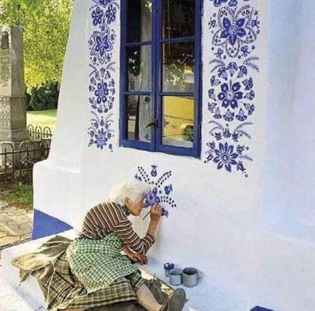 One 94-year-old resident of Louka, Czech Republic, is aiming to make her hometown just as charming as the pictures of the little hand-painted villages seen in story books. Anežka (Agnes) Kašpárková, a former agricultural worker, picked up the wall decoration hobby from another local woman who had been doing the same for years. Using vibrant blue paint and a small brush, she creates intricate floral wall murals inspired by traditional Moravian (southern Czech) artwork. Do you love her artwork?