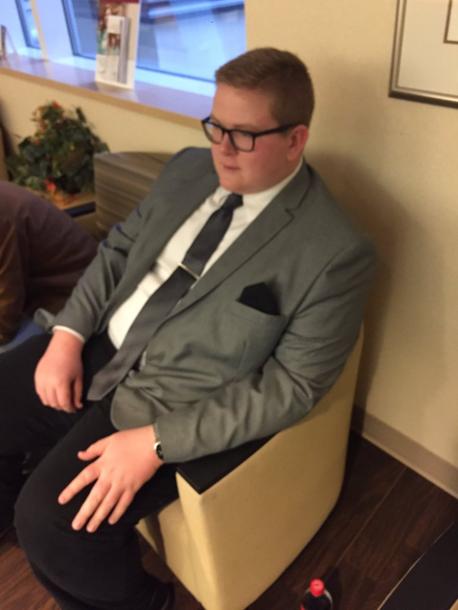 Eighteen-year-old Grant Kessler, of Ohio, was out in the waiting room while his older sister gave birth, when his other sister took a picture of him in his suit. When asked why he was wearing a suit for this occasion, Grant replied - 
