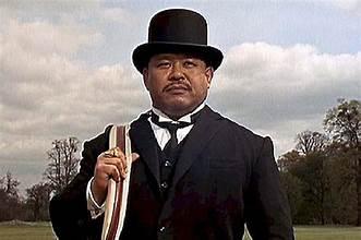 Oddjob - In the James Bond film 'Goldfinger', Olympic weightlifter Harold Sakata plays Goldfinger's bodyguard / butler. Can crush golf balls in his hand and has a razor-rimmed that can sever statue heads. Ever play a round of golf with a caddy as opposed to a golf cart or carrying the clubs yourself?