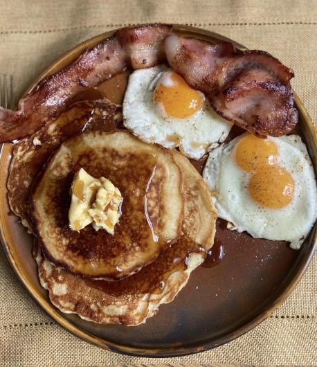 A full Canadian breakfast is a lovely sight to behold! Cinnamon and Maple syrup pancakes, bacon or sausage and maple fried eggs (warm 1 or 2 tablespoons of REAL maple syrup in non-stick pan. Crack egg into syrup and cook to your liking while spooning syrup in pan on top of egg). Source: get cracking.ca/recipes. Have you visited Canada?