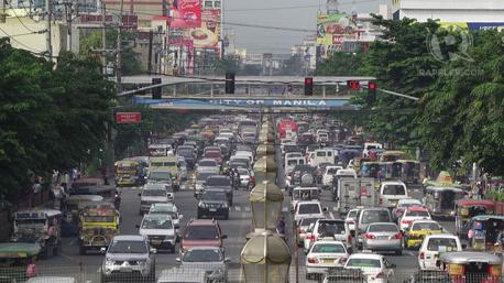 Would you want to learn how to drive like a local of a foreign city? (Picture is traffic in Manila.)