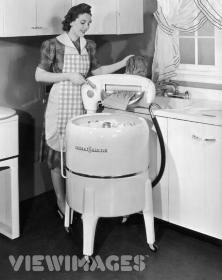 My grandmother had a washing machine like the one in the picture that hooked up to the sink in her laundry room. For years she refused to let us buy her new one because in her words