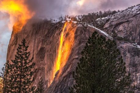 Horsetail Falls, Yosemite National Park, California - Timing has to be just right to see this illusion. For most of the year, Horsetail Falls is a small waterfall in Yosemite National Park. According to the National Parks Service, something magical happens at sunset near the end of February. During this time, the waterfall looks as if it's on fire. The reflection of the sun hitting the falling water just right makes it look like lava pouring over the edge of the mountain. Not only must the time of day and time of year be just right, but Mother Nature must cooperate as well. If there is even a small cloud cover, it can completely ruin the illusion. It lasts only about 10 minutes. Have you ever visited Yosemite National Park?