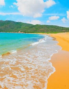 Porto Ferro, Sardinia, Italy - The bright, light <orange> color of the sand is a result of crushed shells, volcanic deposits, and limestone. The clear blue waters and the green trees surrounding it, make the color stand out even more. Visitors can get a breathtaking view from the 65-foot-high sand dunes behind the beach. Have you visited Italy?