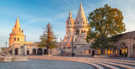 Spired Towers - Fisherman's Bastion - Budapest - One of the most popular tourist sites in Budapest, with a mesmerizing view of the Danube River and Hungary's ornate Parliament Building. The original hilltop castle was built as a defensive structure during the 16th century. It overlooked a part of the city called Watertown, where fishermen lived and worked. However, much of the original structure was destroyed and rebuilt over the years. The current structure was built in 1895 for Hungary's millennial celebration. It is notable for its seven spired towers, which represent the seven tribes that originally settled Hungary in the 19th century. Are you familiar with this castle?