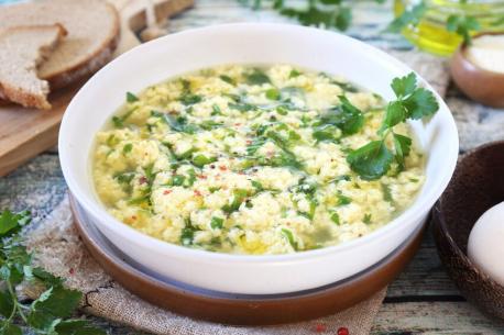 Stracciatella, Italy - This Italian egg drop soup features an egg and cheese mixture drizzled in a meat broth, forming strands or 