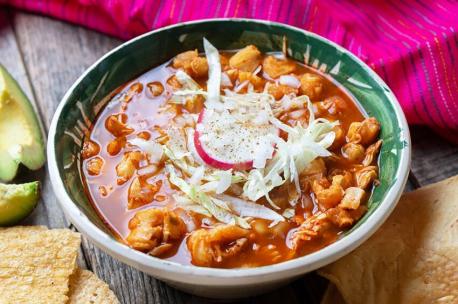 Pozole, Mexico - This traditional Mexican stew, is usually a mixture of pork, hominy (coarsely ground corn), garlic, and broth. Although the stew's exact history in Mexico is unknown, the original recipe is referenced in written accounts of the area by Spanish conquistadors. The original pozole was only served on special occasions by the Aztecs and other Mesoamerican indigenous peoples since corn was considered a sacred crop. Today, it is served all over Mexico and regularly at holiday celebrations. There are three variations: pozole rojo (red pozole with red salsa), pozole verde (green pozole with green salsa), and pozole blanco (white pozole without salsa). Have you tried this Mexican dish?
