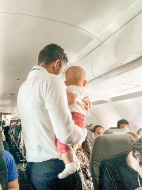 Cherish handed Adalynn over to Frontier Airlines flight attendant Joel Paris, who immediately took the little girl on a walk up and down the aisles. For 10 to 15 minutes he chatted with the baby while showing her around the airplane, bouncing her up and down until she giggled back at him. Have you ever seen a flight attendant go above and beyond to help out a passenger like Mr. Paris did for Cherish Terry and her daughter Adalynn?
