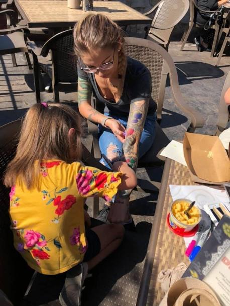 Maja started with lunch at Barrio Tacos where she practiced her tattoo artistry on a server – with a Sharpie. Would you be willing to let Maja practice her tattooing skills on you with a marker?