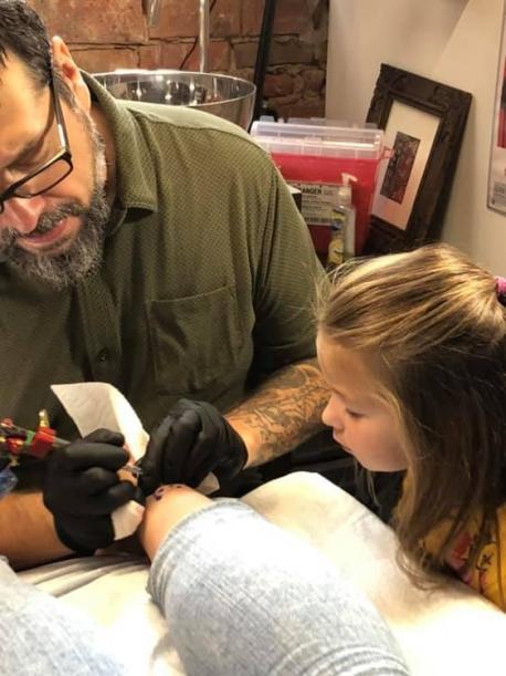 Next, Maja was given her uniform and introduced to her trainer, Dave, and the rest of the team at Voodoo Monkey Tattoo. She toured the facility and was shown the tools and equipment used for tattooing. Have you ever visited a tattoo parlor - either for yourself or a friend getting a tattoo?