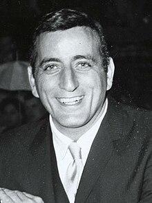 Anthony Dominick Benedetto (1926–2023), known professionally as Tony Bennett, was an American jazz and traditional pop singer. He received 20 Grammy Awards, a Lifetime Achievement Award, and two Primetime Emmy Awards. Bennett was named an NEA Jazz Master and a Kennedy Center Honoree and founded the Frank Sinatra School of the Arts in Astoria, Queens, New York. He sold more than 50 million records worldwide and earned a star on the Hollywood Walk of Fame. Do you remember him?