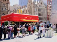 (The Independent): McDonald's has opened a pop-up giant lunch box in Australia. The violently red cuboid, the lid of which flips up for service, will tour Australian cities including Perth, Adelaide, Sydney and Melbourne, where the fast food chain is known as Macca's. Have you heard about this?