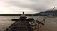 #3 Vitim River Crossing: 600 meter long river crossing bridge in siberia. It is narrow & not much safe making it really dangerous. During winters and rain storm it really takes guts to travel here.