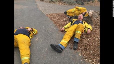 Here are a couple of hero firefighters, resting, just about anywhere so they can recharge for their next round of fighting fires. Do you personally know any fire fighters?