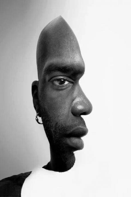 Is the man facing forward or sideways?