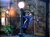 This one is surprising in that they were able to film it without serious injury to its leading performer. Can you name the movie and the iconic song from it? If you can sing more than 3 lines from the song I will give you 10 (completely worthless) bonus points.