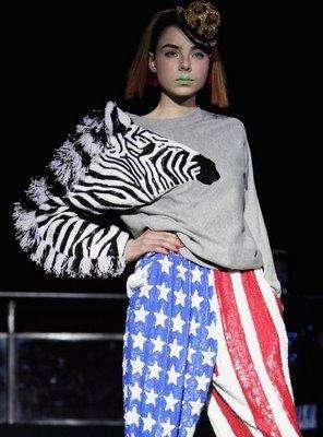 Incorporating animals parts into an outfit is not new, this one uses both the American flag and the zebra. Do you like what you see in this outfit? (The photo is cropped)