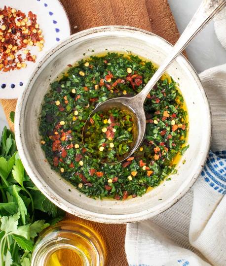 Chimichurri is an uncooked sauce used as an ingredient in cooking and as a table condiment for grilled meat. It is made of finely chopped parsley, minced garlic, olive oil, oregano and red wine vinegar or lemon juice. It comes in green (chimichurri verde) and red (chimichurri rojo) varieties. The sauce is widely used in Latin America. Have you ever heard of Chimichurri sauce?