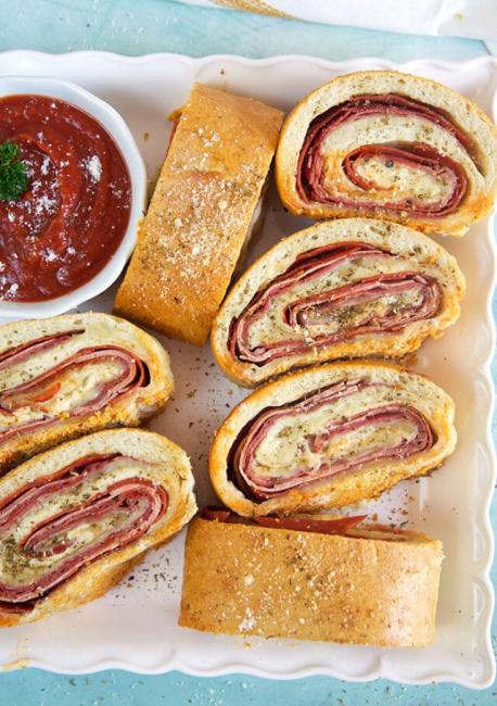 Stromboli is a delicious Italian-American dish that resembles a rolled-up pizza with various fillings inside. The name comes from a volcanic island off the coast of Sicily, where the dish was supposedly invented by Italian immigrants in the 50's. Have you ever heard of Stromboli?