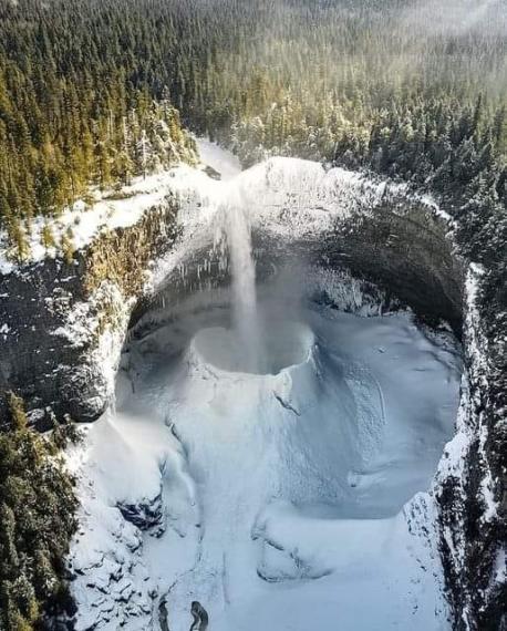 This is Helmcken Falls in British Columbia, Canada in the winter. The aerial view shows us a spectacular wintry scene. Do you like this interesting view of the falls with the action being frozen instead of water falling and running vigorously?