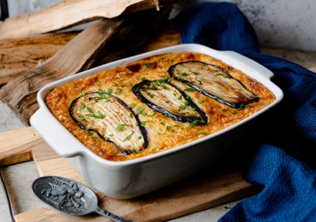 Moussaka is also common in the Balkans and the Middle East, with many local and regional variations. There's a vegan version that replaces meat with mushrooms or a mix of sautéed onions and rice. Would you like to try the meatless version of Moussaka?