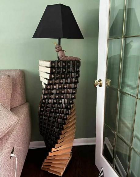 Someone found a set of discarded Encyclopedia and turned it into this interesting floor lamp! What's the most unusual item you've ever bought at a thrift store or yard/garage sale?