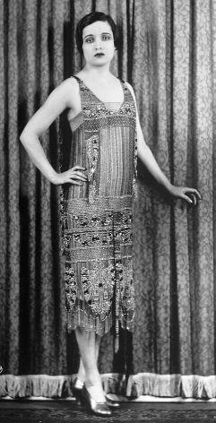 During the Roaring '20s, the hourglass shape gave way to the boyish flapper figure and underwear got an overhaul. The goal of every undergarment was to flatten the breasts and torso, so that flapper dresses could hang straight down without any curvaceous interruptions. Corset-makers R. & W.H. Symington invented a garment, the Symington Side Lacer, that would flatten the breasts. The wearer would slip the garment over her head and pull the straps and side laces tight to smooth out curves. Other manufacturers designed similar devices. The Miracle Reducing Rubber Brassiere was