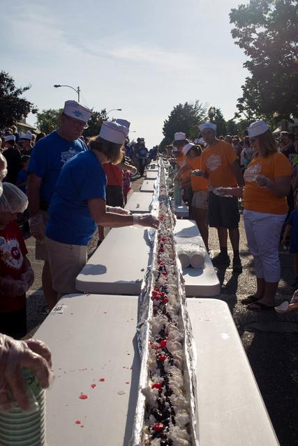 I spent many days this past summer enjoying the above average summer temperatures in Ludington. Unfortunately, I missed the streets of downtown Ludington being filled with 12,700 scoops of ice cream, 2,000 Michigan maraschino cherries and 600 cans of whipped cream. Guinness World Records says a roughly half-mile-long ice cream sundae was gobbled up back in June. The record setting sundae measuring a little over 2,970 feet in length fed thousands of people lining eight blocks. Several things needed to be accomplished in order for the record to be broken including official measurement and documentation. The dessert also had to be continuous in nature, covered with toppings and eaten completely. Would you have liked to have participated in this event?