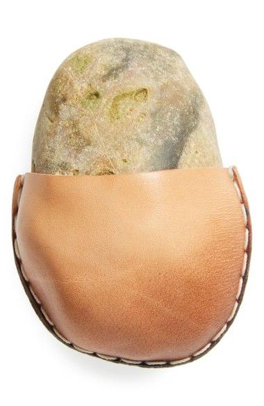 In what is apparently not a joke but in fact real life, the department store is selling a rock in a little leather pouch for an absurd amount of $85. Have you heard about this item that has been for sale at Nordstrom since November 18th?