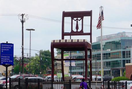 Washington D.C. - The Big Chair Sculpture in DC was built in 1959 and it was originally designed to be used as an advertisement for Curtis Brothers Furniture company. The chair is 19 1/2 feet high and is a detailed replica of a Duncan Phyfe style chair. It sits on a concrete base and weighs around 4,000 pounds. The Chair has grown from a furniture advertisement into a beloved neighborhood landmark. Because it is so loved, rioters spared the chair during the 1968 riots. It is one of the few landmarks that survived the riots completely unscathed. Have you ever visited this chair?