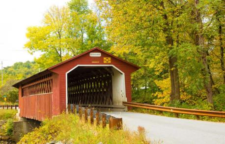 Vermont: Silk Covered Bridge - Vermont is another New England state famous for its covered bridges. This one has been straddling the Walloomsac River since the 1840s, spreading across 88 feet (27m) with intricate latticed detailing in its interior. In fall, its orange-red expanse blends beautifully with the surrounding foliage. Have you ever visited this bridge?