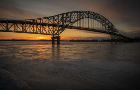 New Brunswick, Fredericton - Burton Bridge - This distinctive truss arch bridge sits near Fredericton, technically connecting the communities of Maugerville and Burton. Built in 1972, it replaced a ferry service and feeds into a former portion of the Trans-Canada Highway. The Burton crosses the Saint John River, a winding body of water that travels from the American state of Maine through New Brunswick and into the Bay of Fundy. Have you ever visited this bridge?