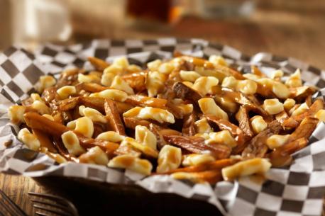 Quebec - What do you get when you put a bunch of French fries with cheese curds on top then drowned in gravy? Well, that is what Canadians call