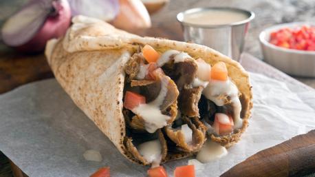 Nova Scotia - Visitors to the maritimes usually flock to the area's quality seafood, but to people living in Halifax, the capital of Nova Scotia, the Halifax donair is the dish to try. It all started in the 1970's with a Greek restaurateur named Peter Gamoulakos who wanted to bring gyros to Canada. The traditional Greek flavors didn't really take with local palates, so Gamoulakos replaced the lamb meat with ground beef and made his own donair sauce out of evaporated milk, vinegar, sugar, and garlic. The sandwich became so popular that it was pronounced the municipality's official food. While the Halifax donair is sold across the city, you can try the original at King of Donair. Have you ever eaten this food?
