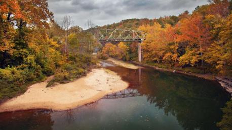 Arkansas: Buffalo National River - Spend a lazy autumn day floating down the beautiful Buffalo River, which in 1972, was declared the nation's first-ever national river, and you'll fall head over heels for fall in the Natural State. Along the way, you'll have plenty of chances to sunbathe on a sandbank under bluffs sporting a splash of color. Have you ever visited this destination?