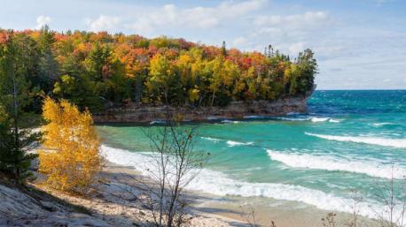 Michigan: Pictured Rocks National Seashore - Pictured Rocks are pretty as a postcard under a blazing summer sun, but when the leaves turn shades of gold and orange, the beauty of this stretch of coast becomes elevated beyond compare. Combine a trip to this stunning seashore with a stop to see the waterfalls at Tahquamenon Falls State Park for the ultimate autumn getaway. Have you ever visited this destination?