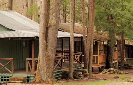 Tennessee: Elkmont Historic District, Great Smoky Mountains National Park - Four photogenic wooden cabins are hidden away in the woodland of the Great Smoky Mountains National Park, forming the Daisy Town part of the Elkmont Historic District. They were originally home to loggers, before becoming swish vacation retreats in the early 1900's, but eventually fell into disrepair. Many similar structures in the area have been demolished, but these four deserted cabins have been stabilized. They can be viewed from outside, and the public can typically also peek inside to see the rustic interiors. Have you ever visited this attraction?