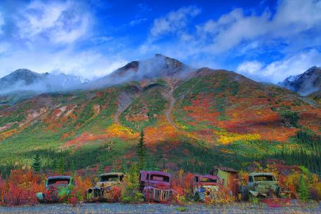 Yukon - My favorite for last! This spectacular photograph shows five trucks abandoned in 1943 that have rusted so severely they now blend in with their natural surroundings. The selection of old vehicles - parked in a row next to each other - have not moved in 73 years and their corrosion is now so advanced the old motors appear camouflaged in front of the green, orange and yellow backdrop. The vehicles were involved in the building of the Canol Road - the 'Canadian American Norman Oil Line' - in the Yukon Territory in Canada. Have you ever visited this attraction?