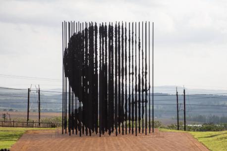 With 50 bars (akin to jail bars) representing the 50th anniversary of Nelson Mandela's arrest, this shape shifting monument at the site of his capture in Howick, South Africa, is multi-dimensional and incredibly symbolic. The artist, Marco Cianfanelli, suggests the sculpture also brings about 