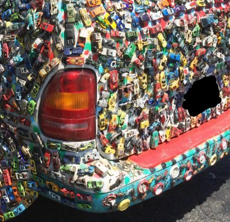 Toy cars, on a real car. Creative?