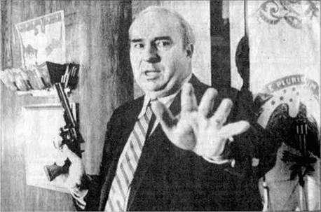 On January 22, 1987, R. Budd Dwyer scheduled a press conference to resign as Treasurer of Pennsylvania. The presser went on much longer than many of the local news reporters had planned for that day. Some cameramen present began to disassemble their equipment during Dwyer's long, rambling, anecdotal, often times incoherent speech. But then he called over his aides, handed out three letter-sized envelopes, and moved back to the dais. He then pulled out a .357 Magnum, warning those still in attendance to stay back — 